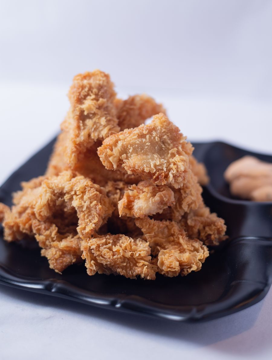 Bucket of fried chicken pieces